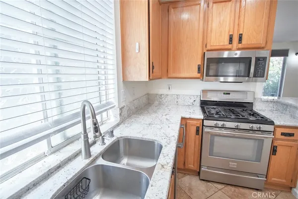 a kitchen with a stove and a sink