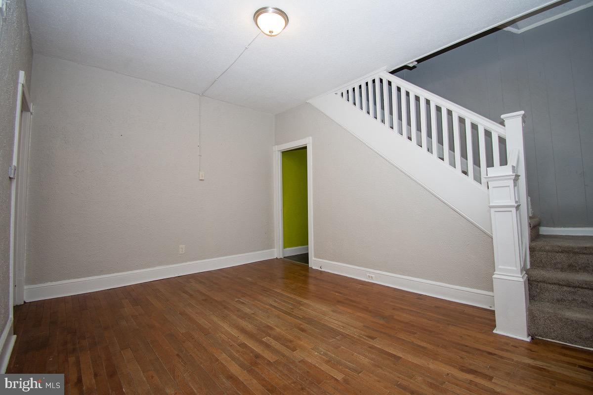 219 West Howard Street Hagerstown, MD 21740 - Photo 3 of 11 a view of an empty room with wooden floor
