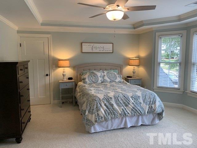 606 Scotts Ridge Trail Apex, NC 27502 - Photo 12 of 22 a bedroom with a bed and a window