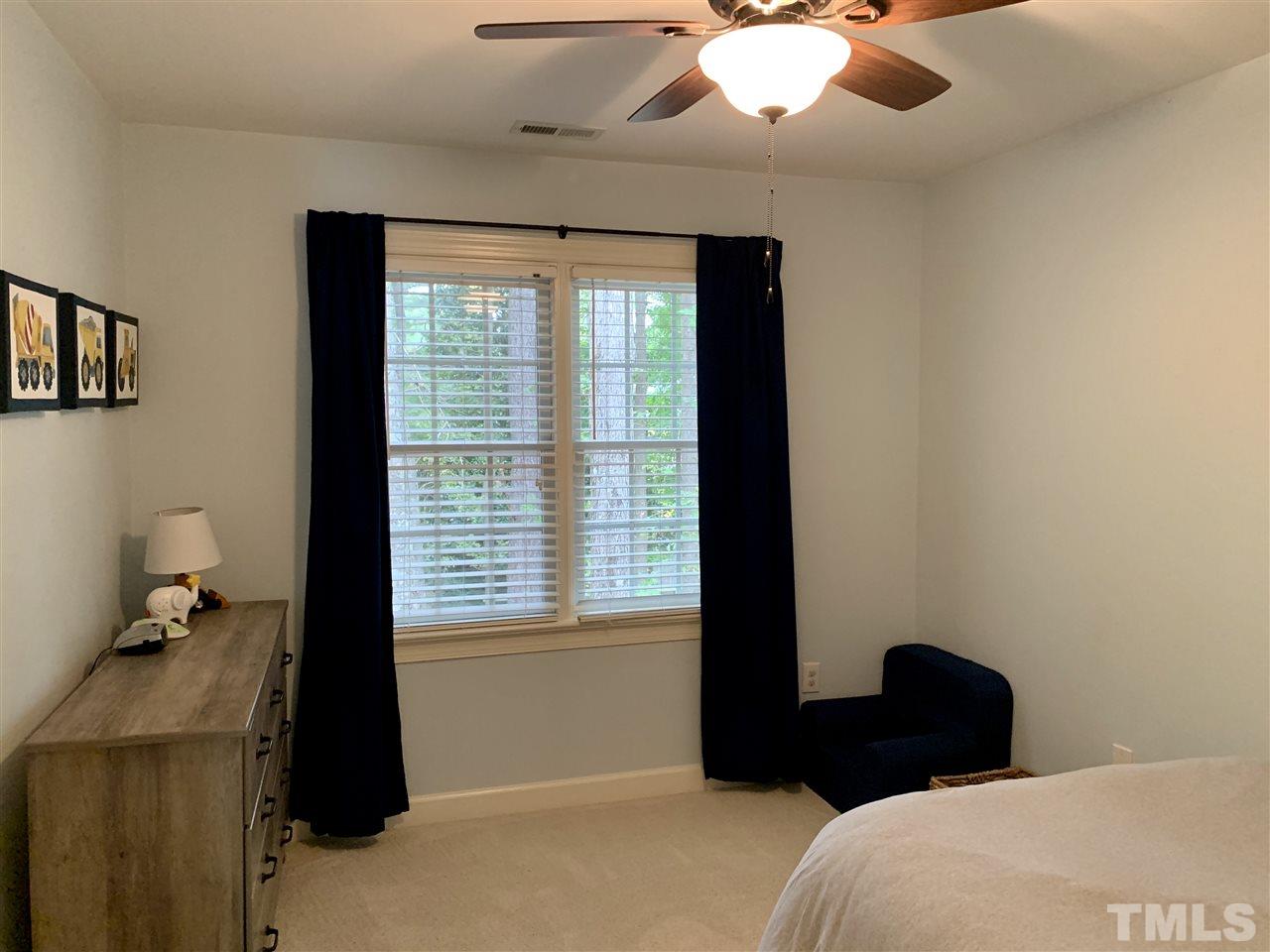 606 Scotts Ridge Trail Apex, NC 27502 - Photo 15 of 22 a bedroom with a bed and a window