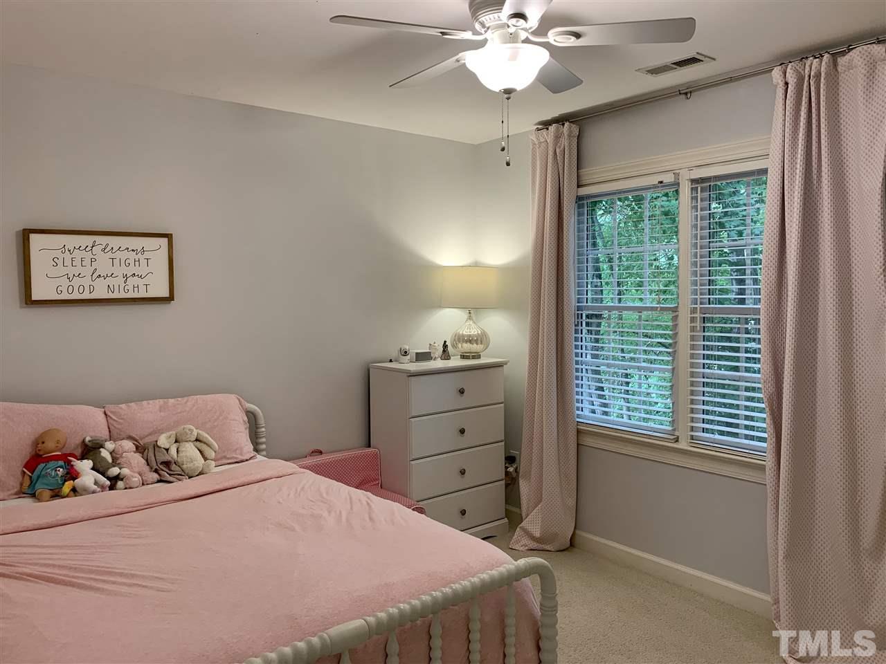 606 Scotts Ridge Trail Apex, NC 27502 - Photo 16 of 22 a bedroom with a bed and a window