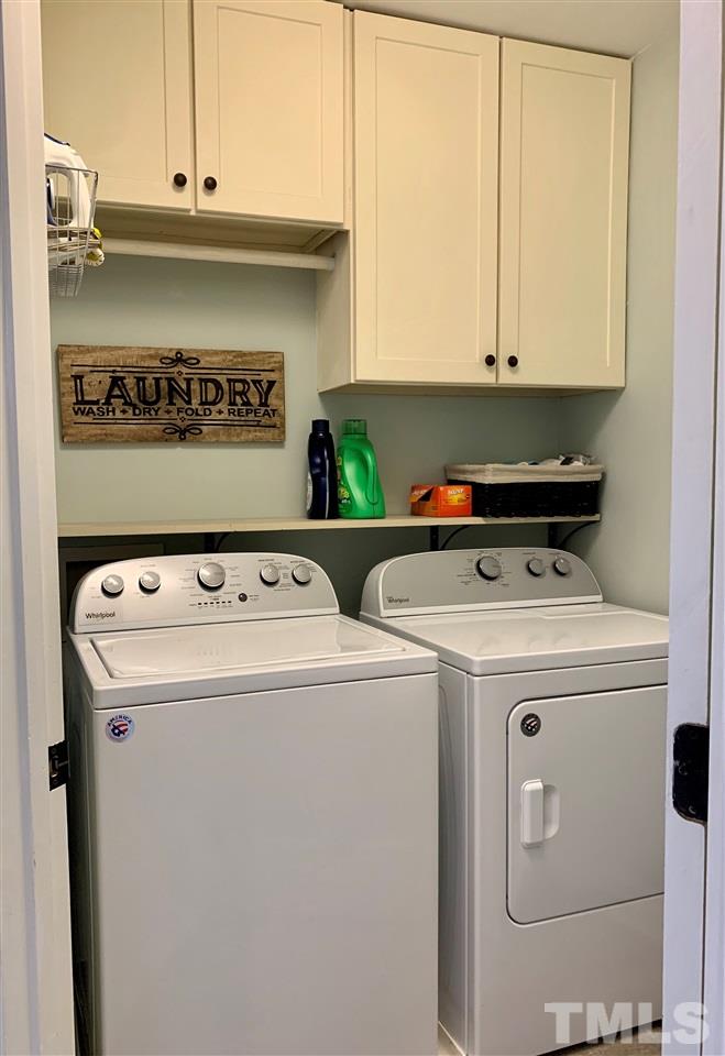 606 Scotts Ridge Trail Apex, NC 27502 - Photo 18 of 22 a utility room with dryer and washer