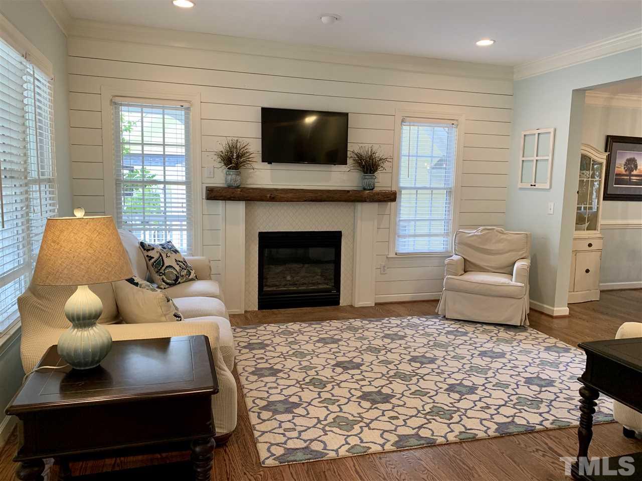 606 Scotts Ridge Trail Apex, NC 27502 - Photo 5 of 22 a living room with furniture and a fireplace