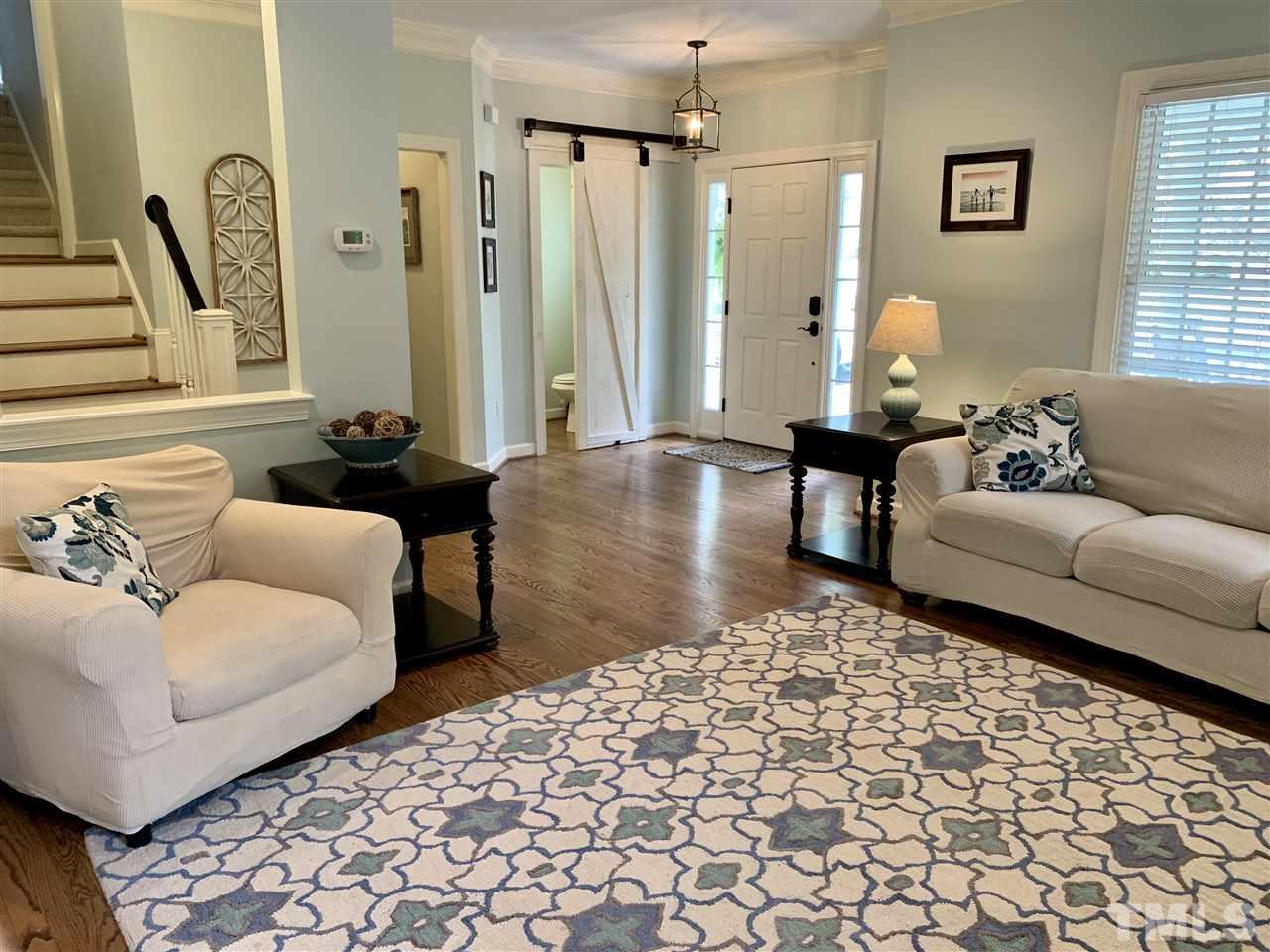 606 Scotts Ridge Trail Apex, NC 27502 - Photo 6 of 22 a living room with furniture and a large window
