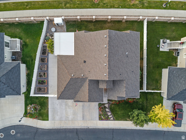 7 Sterling Loop Vineyard, UT 84059 - Photo 43 of 43 Aerial perspective showcasing a property with a multi-gabled roofline and a concrete driveway