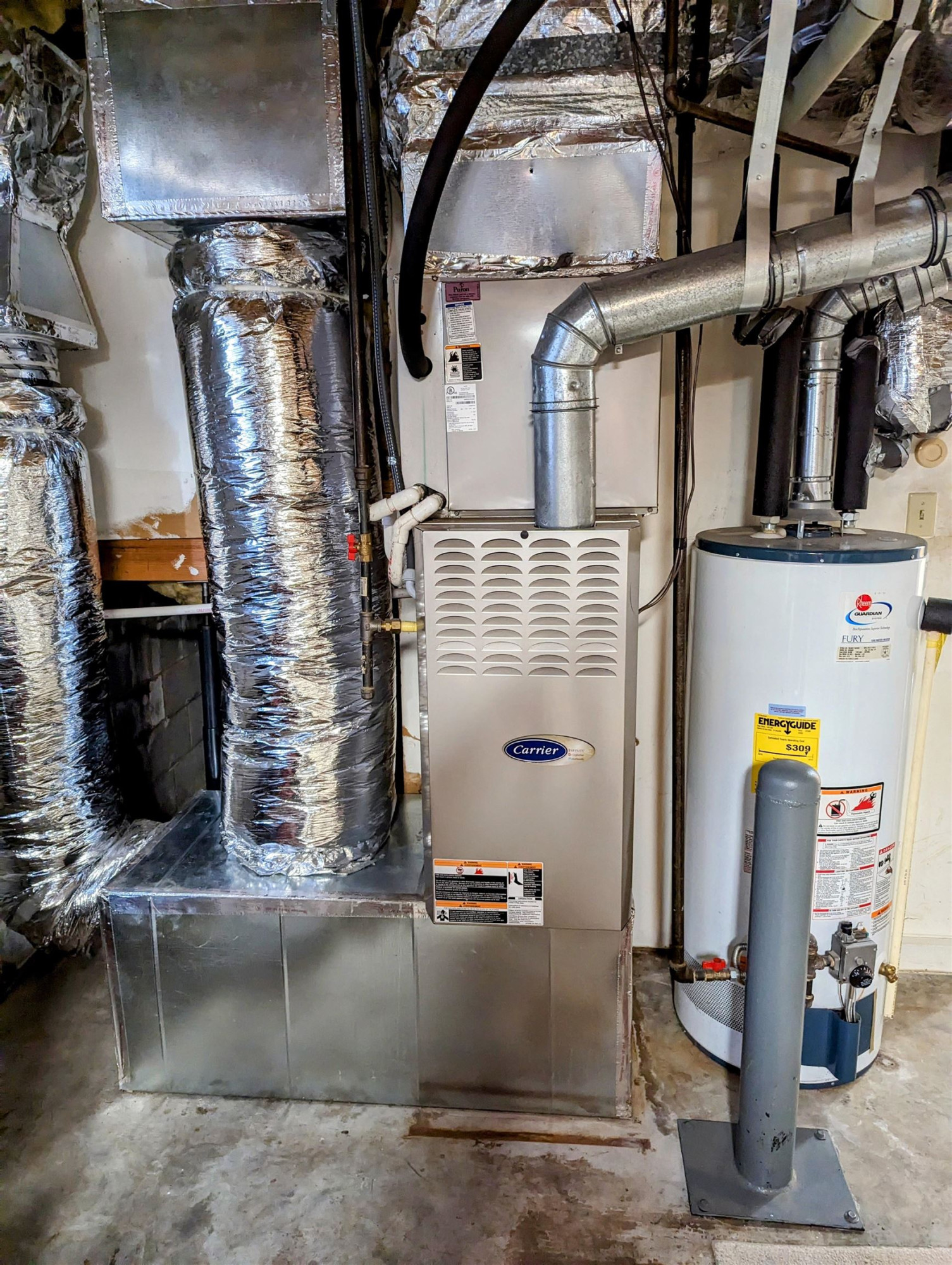 4503 Malvern Road Durham, NC 27707 - Photo 37 of 37 Natural gas furnace and water heater are located in the garage, away from the elements Furnace & water heater
