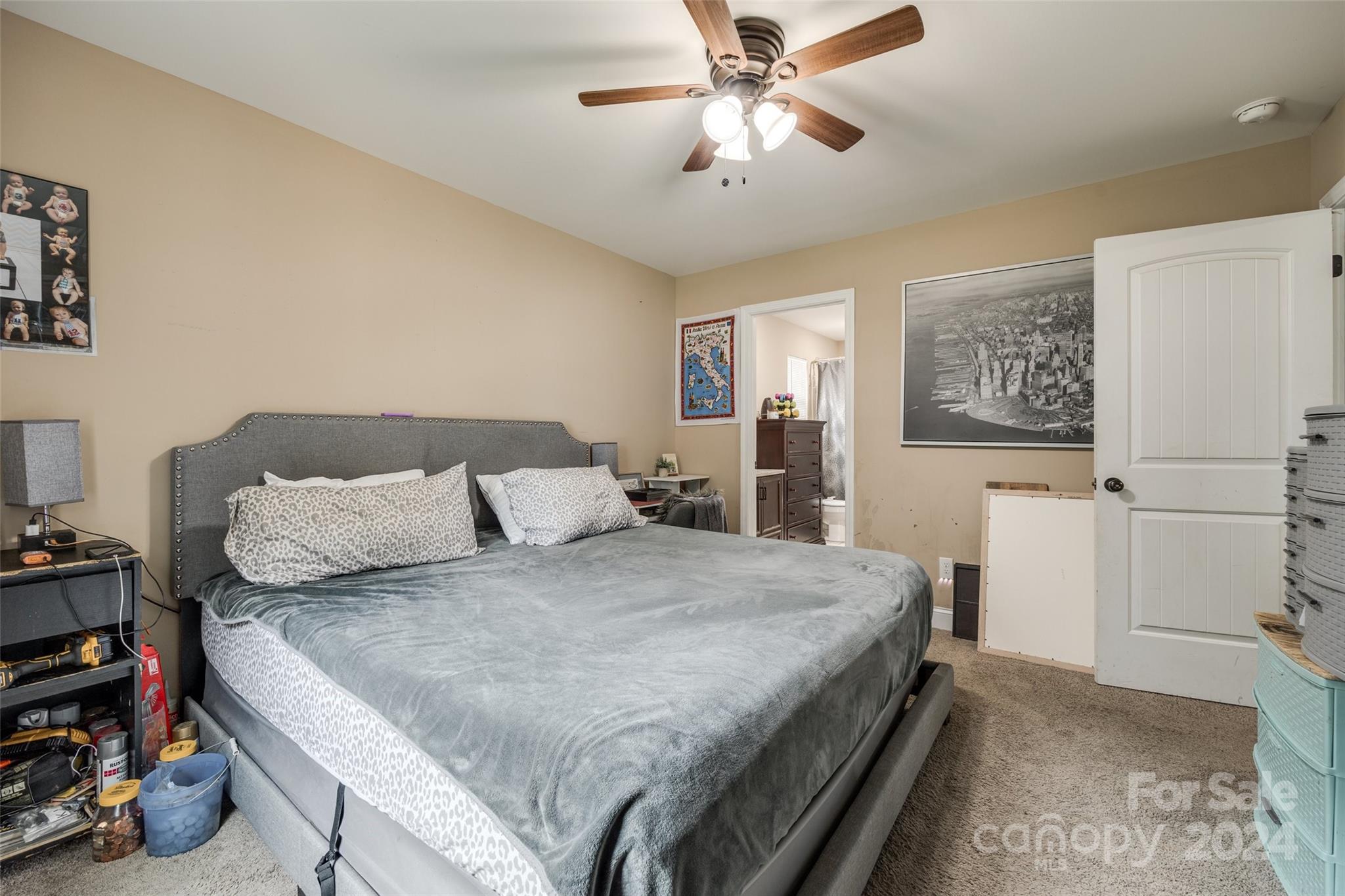 199 Cheek Road Clover, SC 29710 - Photo 15 of 27 a bedroom with a bed and ceiling fan