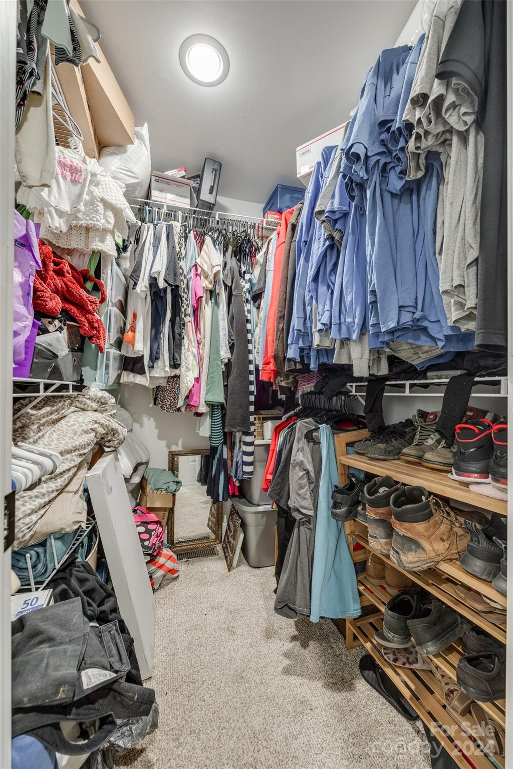 199 Cheek Road Clover, SC 29710 - Photo 17 of 27 a view of walk in closet with clothes