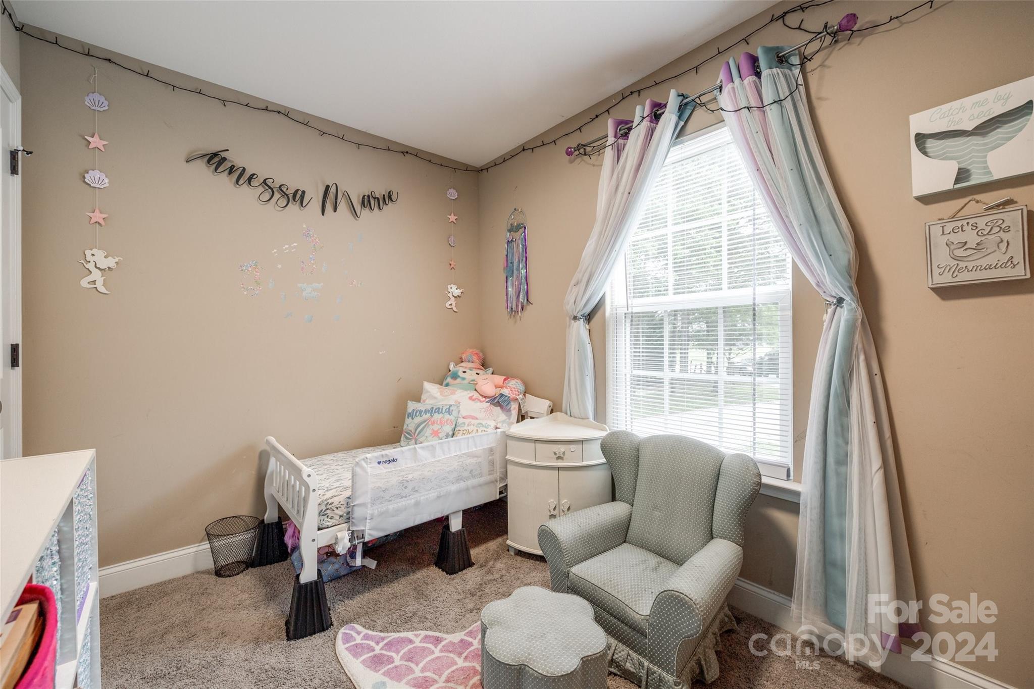 199 Cheek Road Clover, SC 29710 - Photo 18 of 27 a bedroom with furniture and a large window