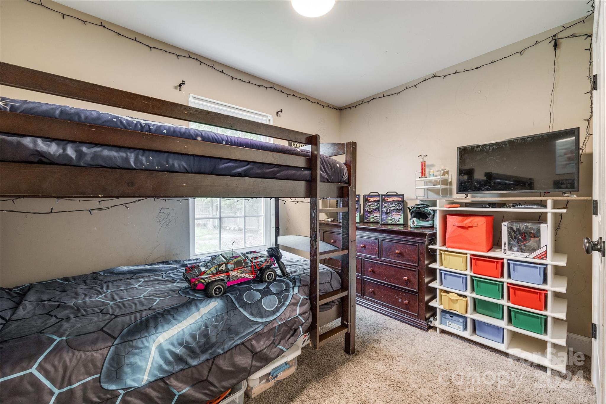 199 Cheek Road Clover, SC 29710 - Photo 20 of 27 a room with furniture and a flat screen tv