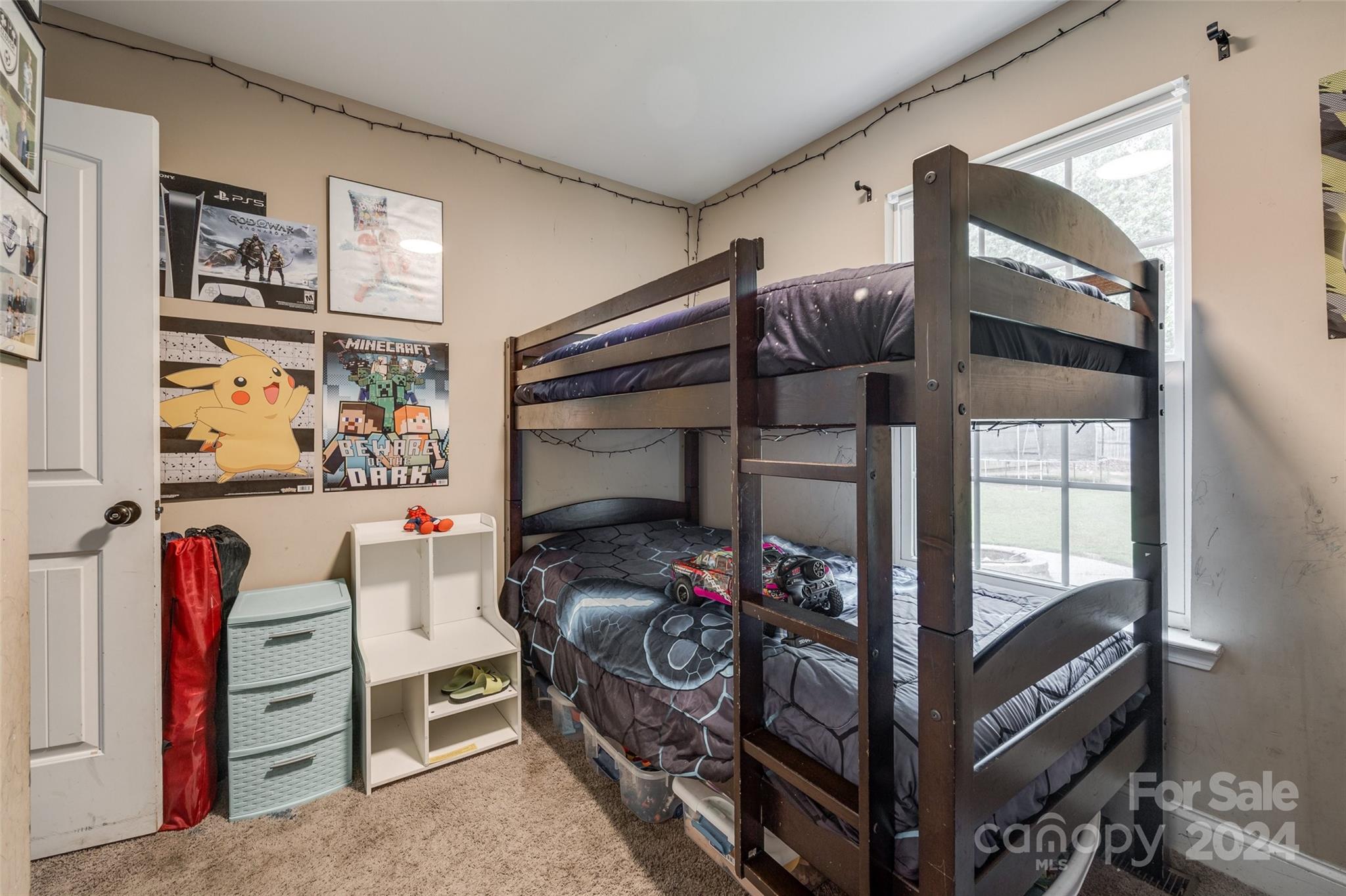 199 Cheek Road Clover, SC 29710 - Photo 21 of 27 a bedroom with a bed and a walk in closet