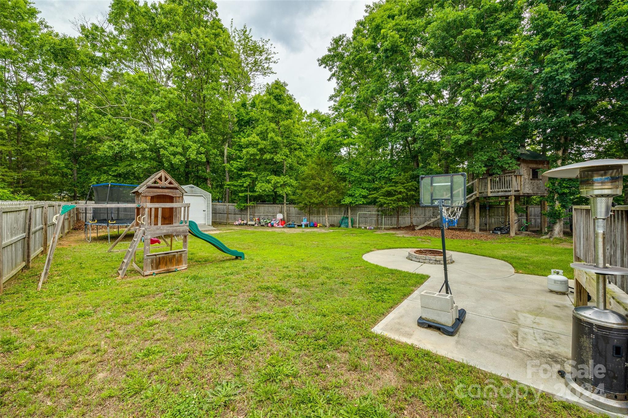 199 Cheek Road Clover, SC 29710 - Photo 25 of 27 a white house with a big yard and more large trees
