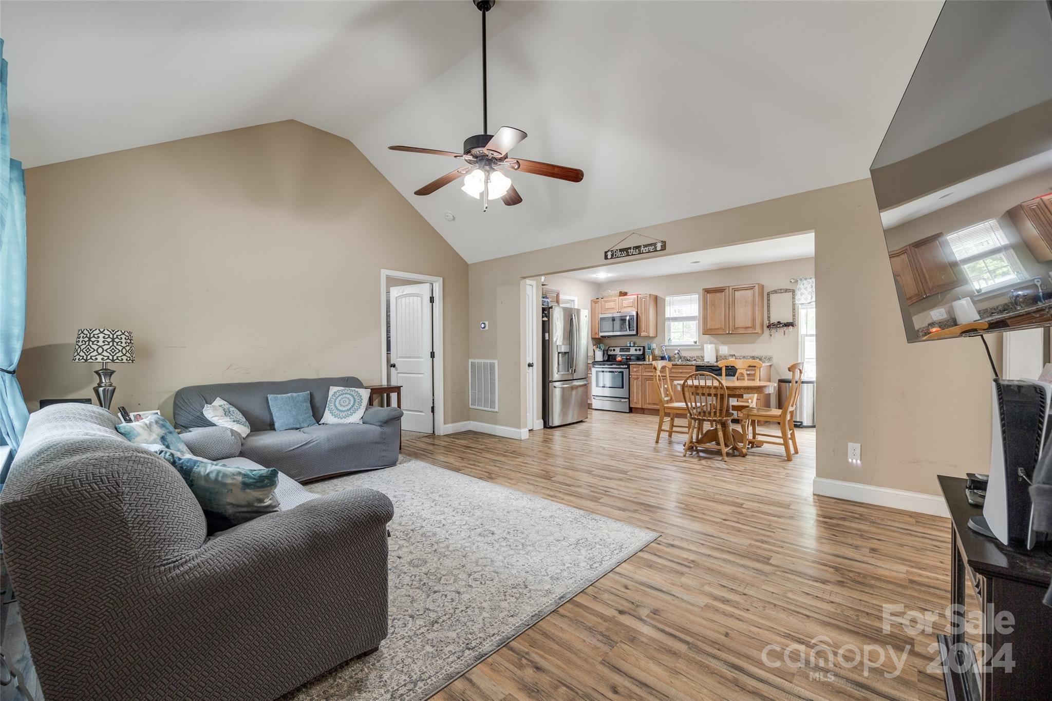 199 Cheek Road Clover, SC 29710 - Photo 4 of 27 a living room with furniture kitchen view and a flat screen tv