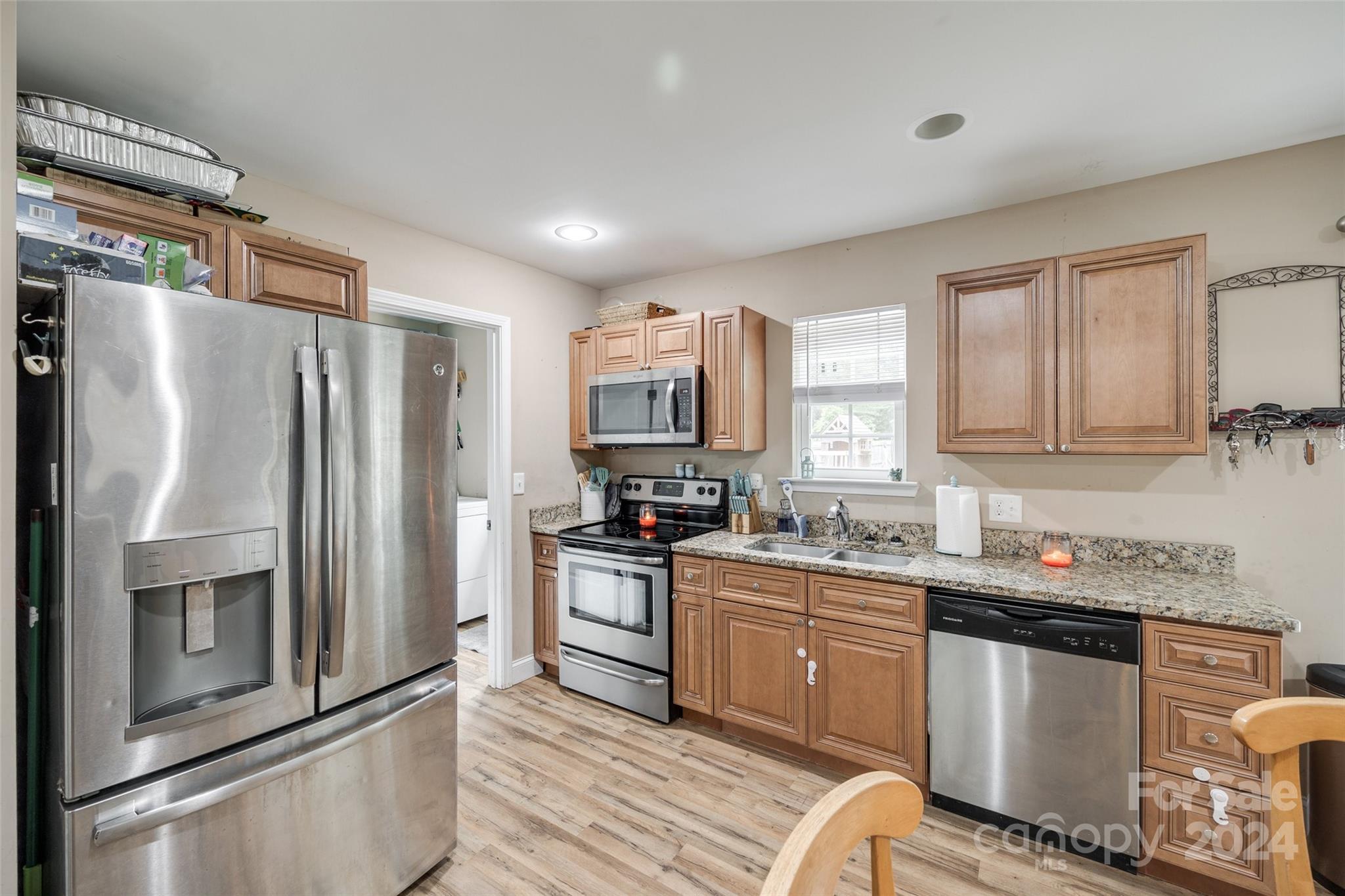 199 Cheek Road Clover, SC 29710 - Photo 10 of 27 a kitchen with stainless steel appliances granite countertop a refrigerator sink and stove