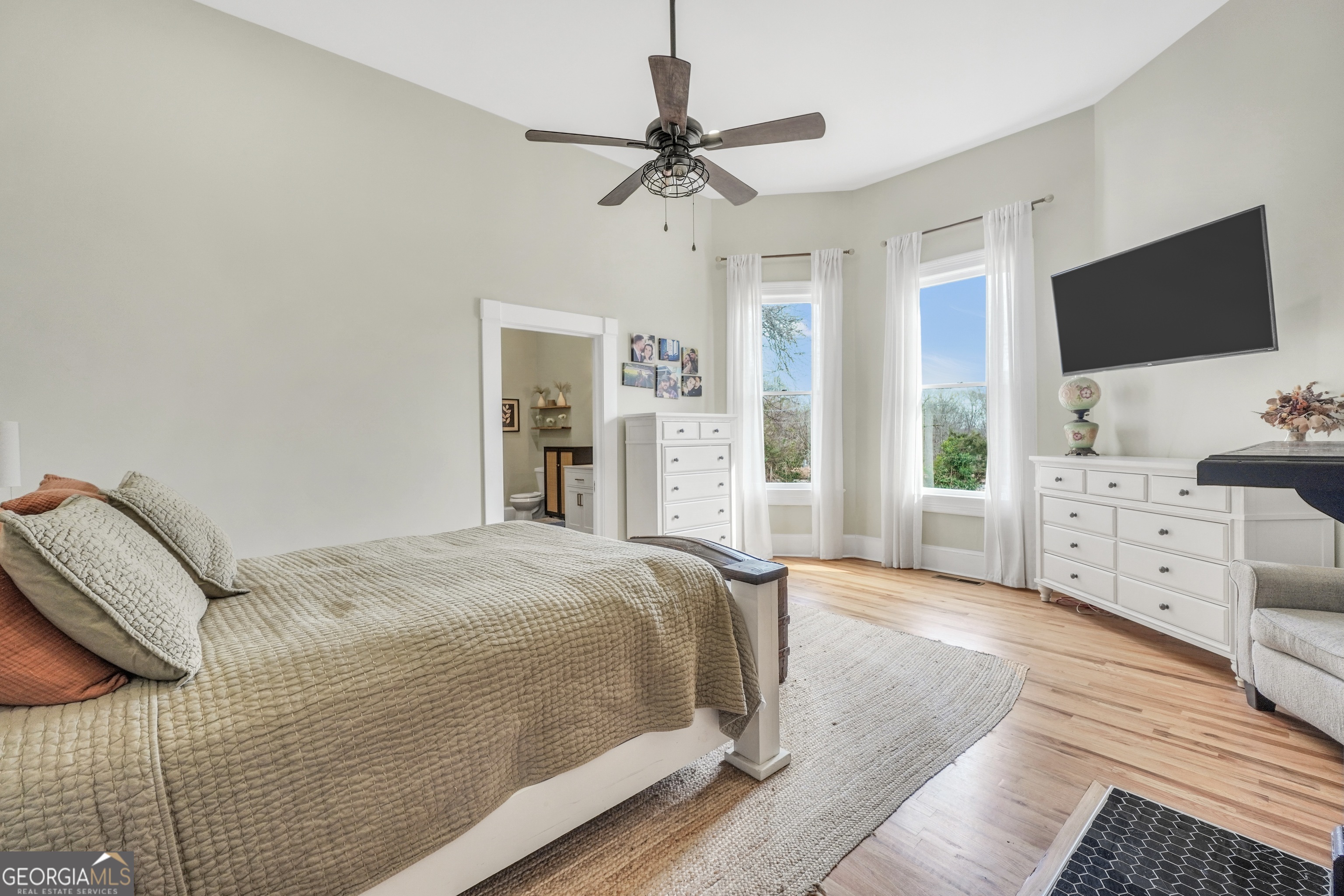 263 Julia Street Monticello, GA 31064 - Photo 24 of 48 a bedroom with a bed and a flat screen tv