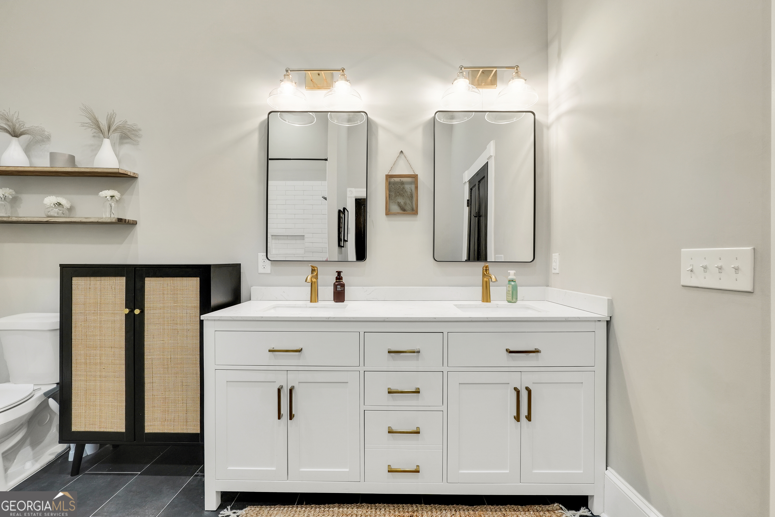 263 Julia Street Monticello, GA 31064 - Photo 30 of 48 a bathroom with a double vanity sink and mirror