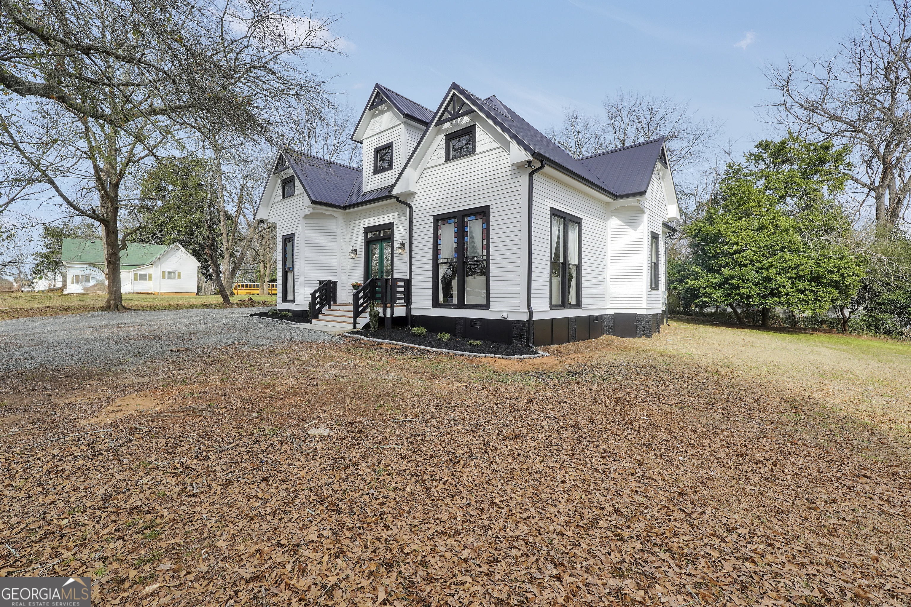 263 Julia Street Monticello, GA 31064 - Photo 3 of 48 a front view of a house with a yard