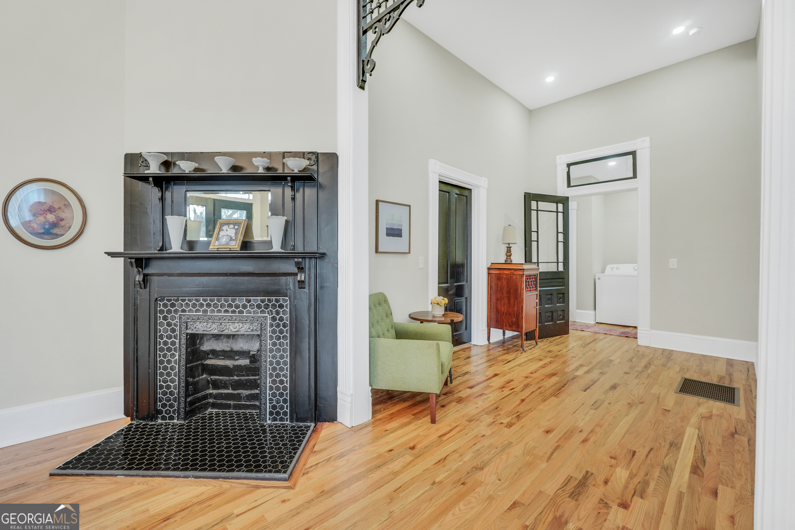 263 Julia Street Monticello, GA 31064 - Photo 34 of 48 a bedroom with a bed and a fireplace