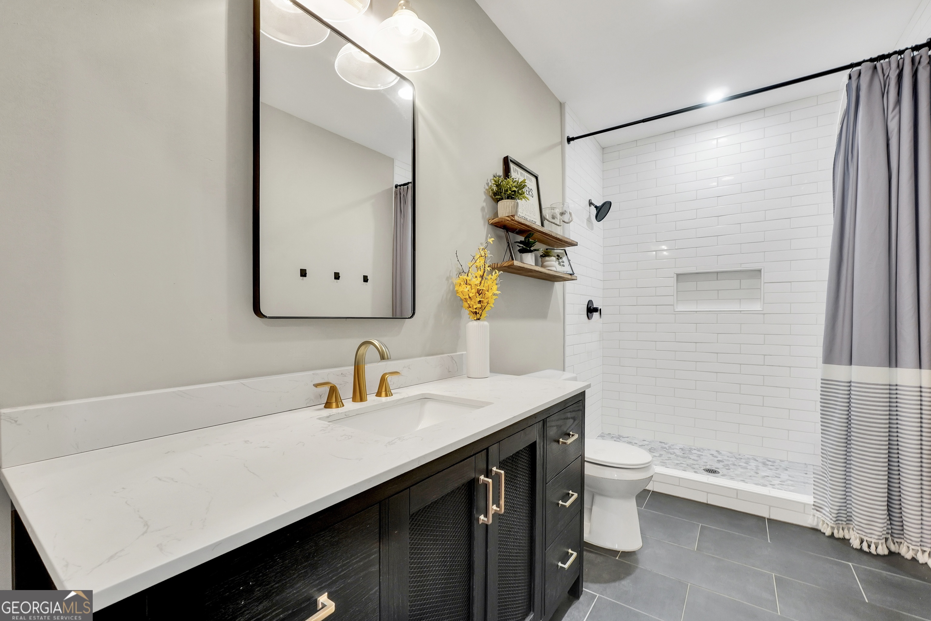263 Julia Street Monticello, GA 31064 - Photo 40 of 48 a bathroom with a sink and a mirror