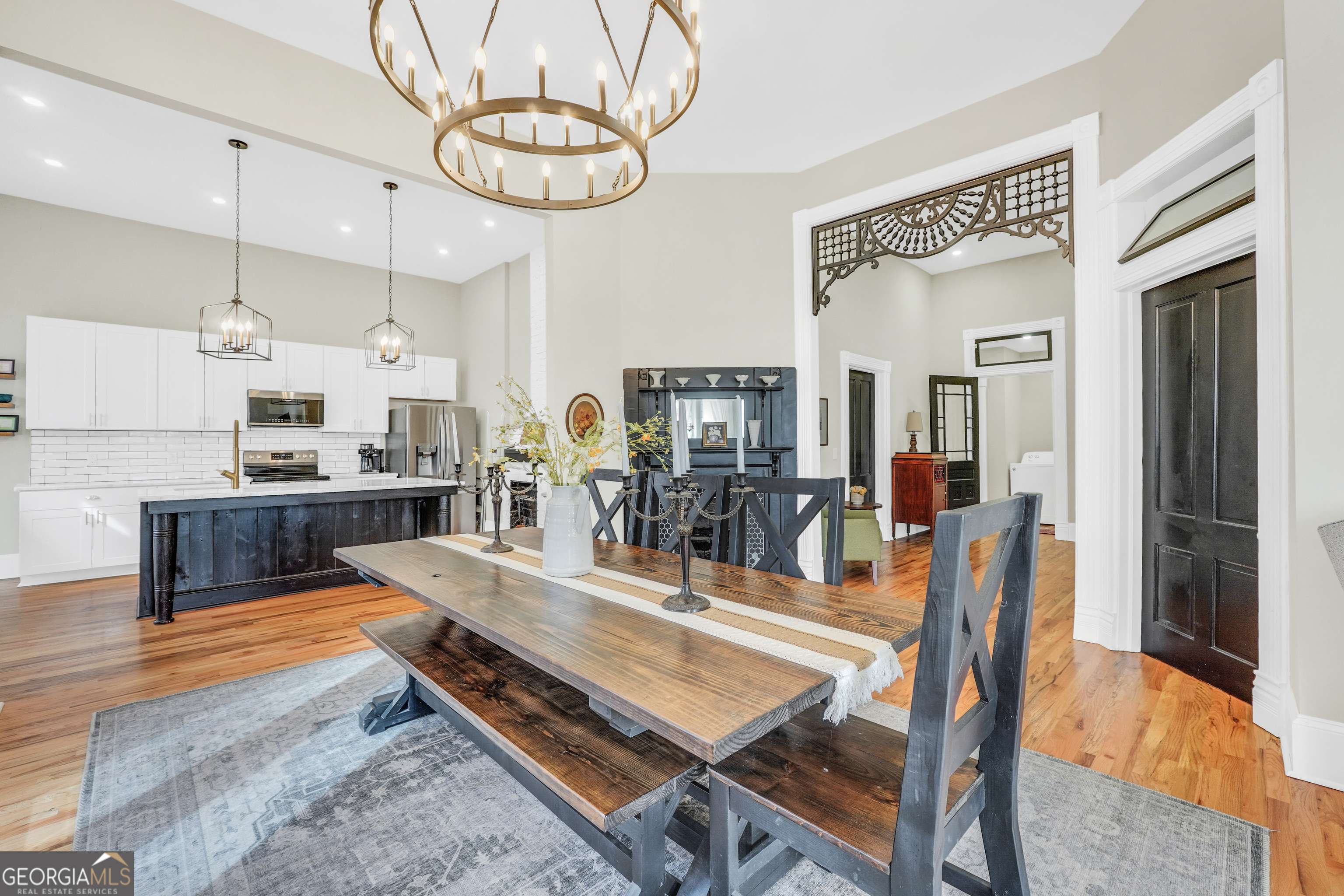 263 Julia Street Monticello, GA 31064 - Photo 7 of 48 a living room with stainless steel appliances kitchen island granite countertop furniture and a kitchen view