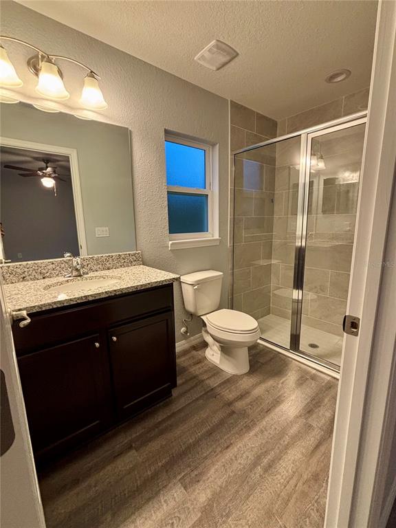 12472 Southeast 67th Terrace Road Belleview, FL 34420 - Photo 13 of 18 a bathroom with a double vanity sink toilet and shower