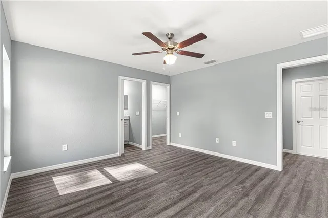 a view of an empty room and wooden floor