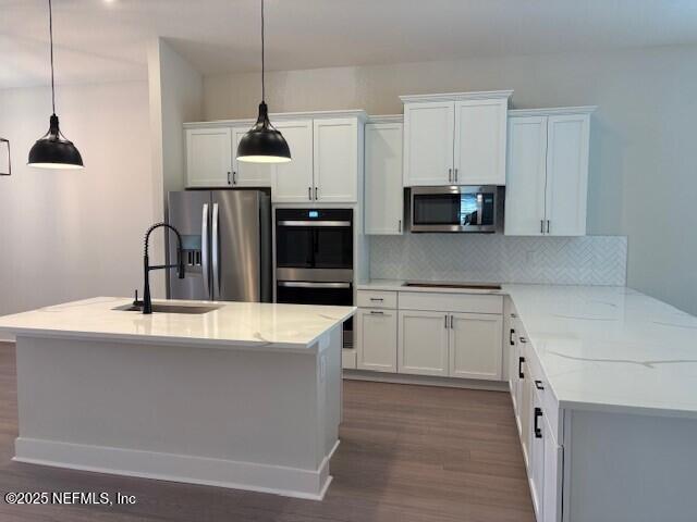 8719 Ford Road Bryceville, FL 32009 - Photo 2 of 11 a kitchen with granite countertop a sink and a stove top oven