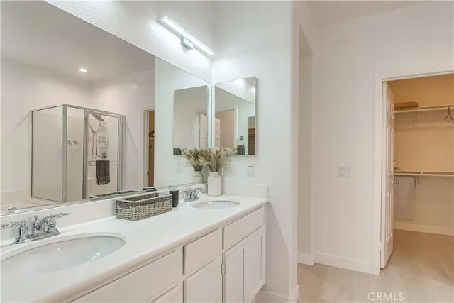 a bathroom with a double vanity sink mirror and double