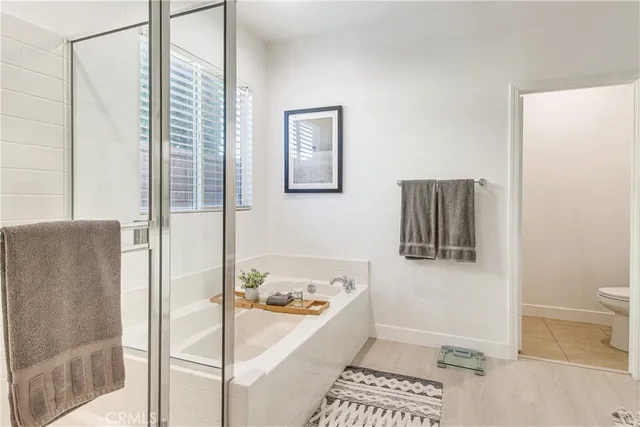 a bathroom with a bathtub and shower