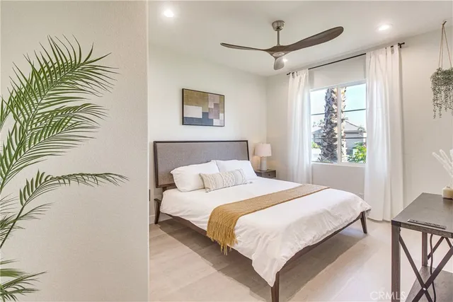 a bedroom with a large bed and a window