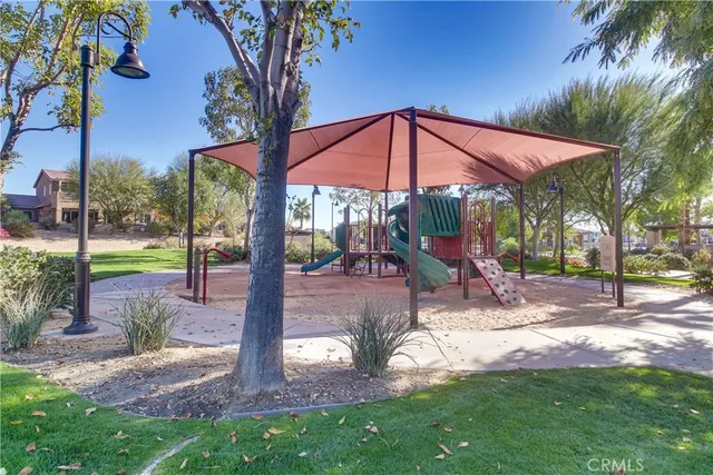 a view of a backyard with sitting area