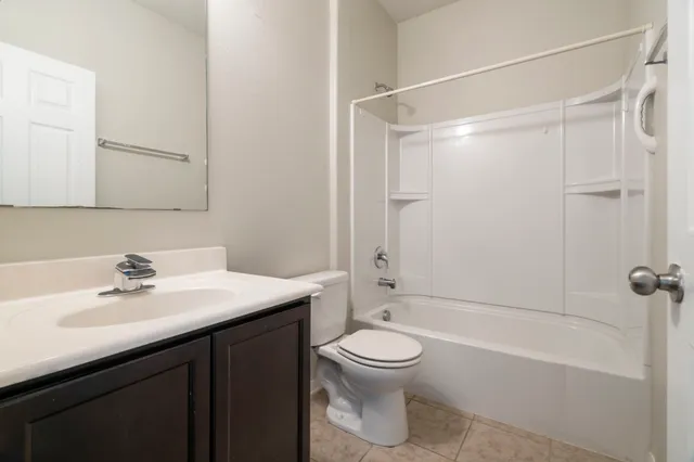 a kitchen with stainless steel appliances granite countertop a refrigerator and a stove