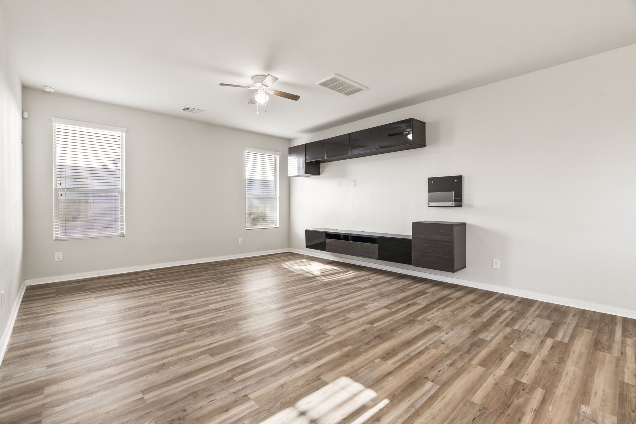 914 Canyon Hill Lane Rosenberg, TX 77471 - Photo 26 of 31 a view of an empty room with wooden floor and a window