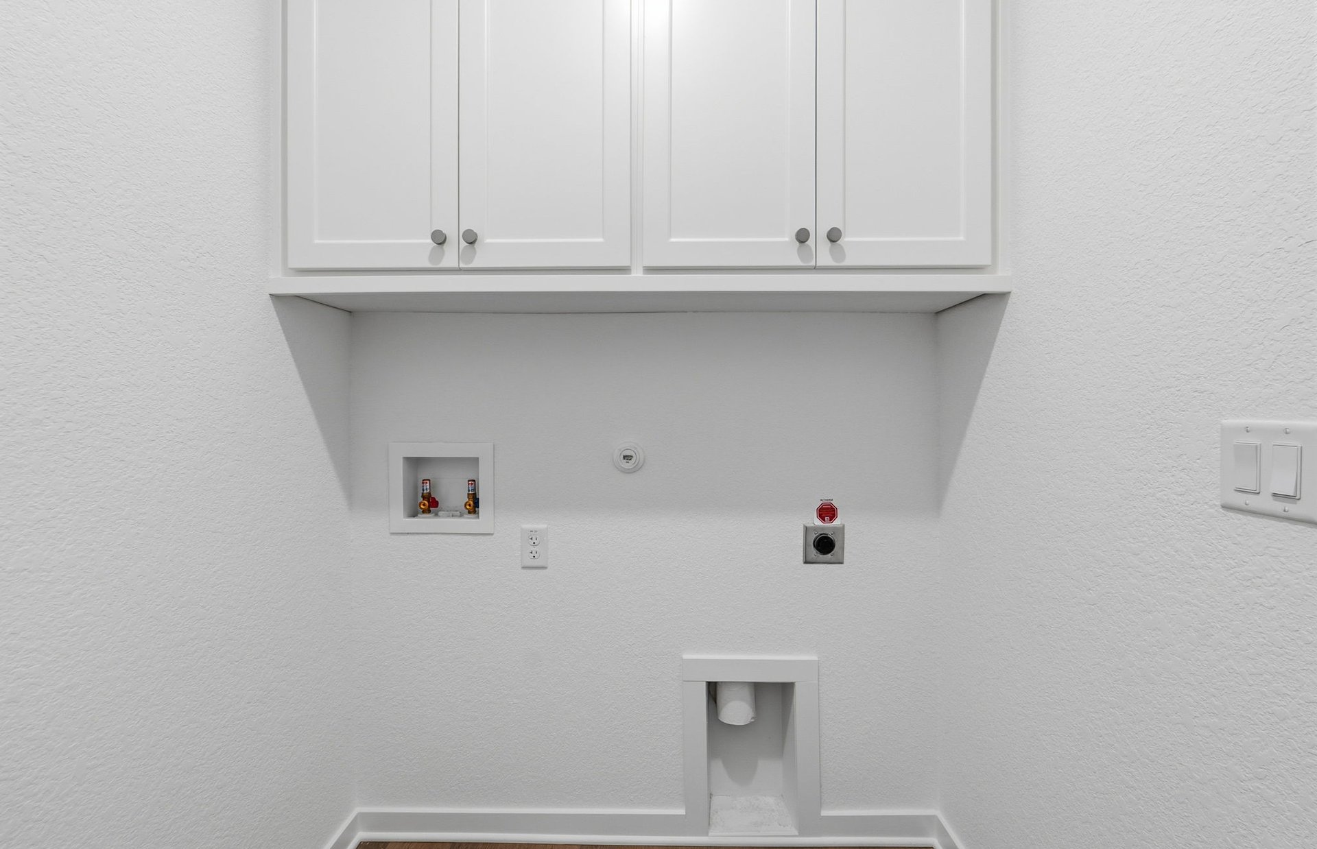 1010 Martingale Street Georgetown, TX 78633 - Photo 13 of 23 a view of cabinets with wooden floor and cabinet