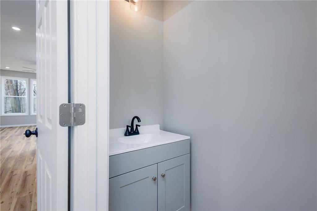 200 Back Pine Way, Unit B Ellijay, GA 30536 - Photo 13 of 29 a bathroom with a sink and vanity