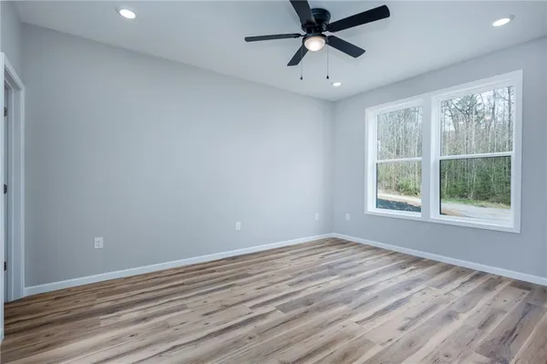 a view of room window and wooden floor