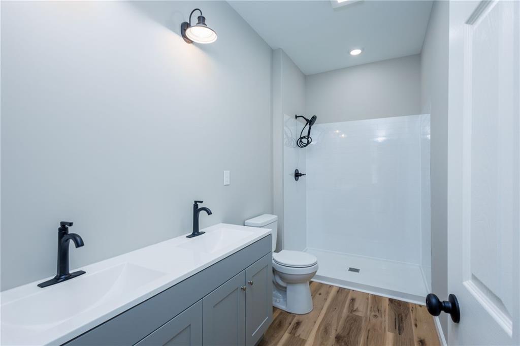 200 Back Pine Way, Unit B Ellijay, GA 30536 - Photo 20 of 29 a bathroom with a sink a toilet and shower