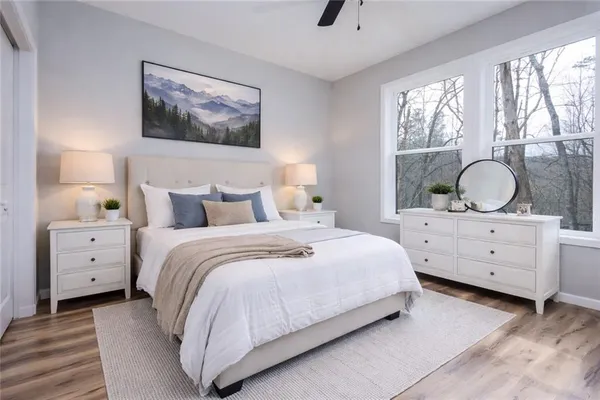 a bedroom with a bed and a dresser