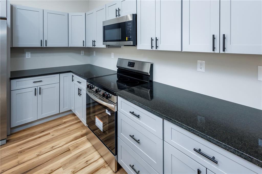 200 Back Pine Way, Unit B Ellijay, GA 30536 - Photo 6 of 29 a kitchen with cabinets appliances and a sink