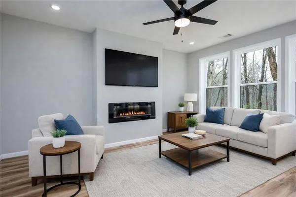 a living room with furniture and a fireplace