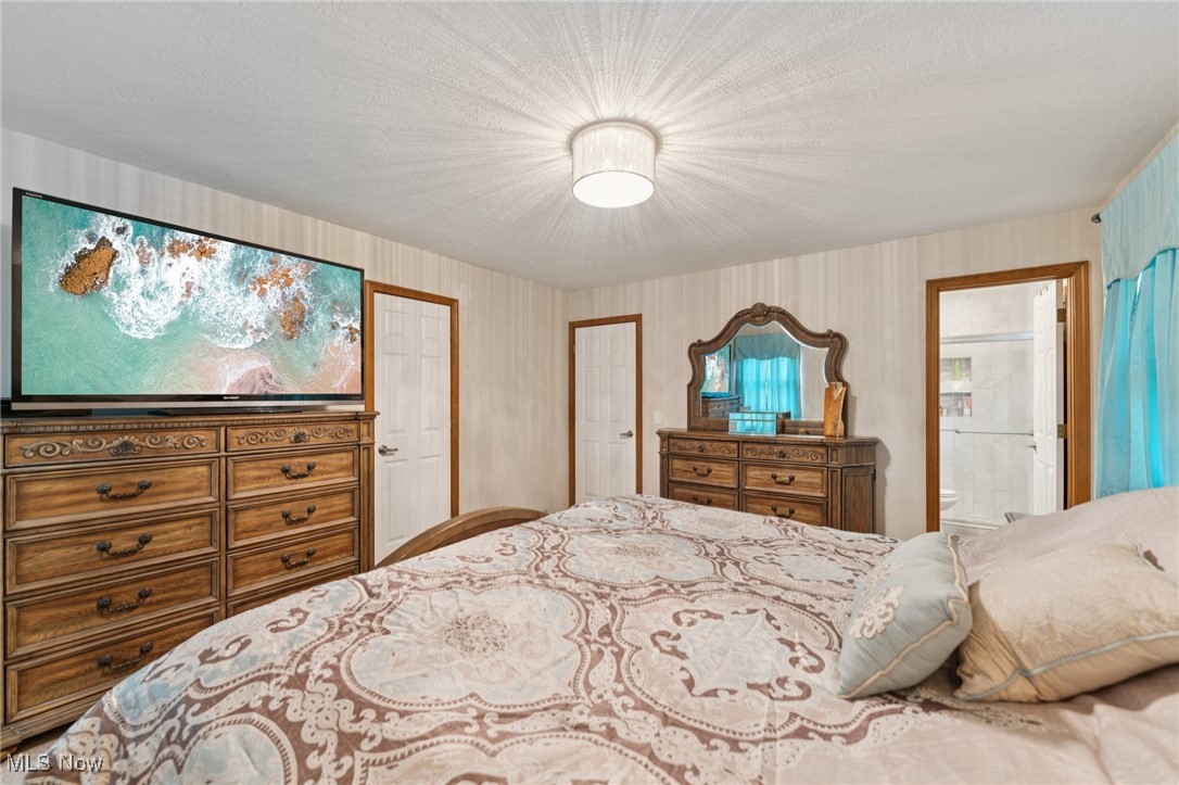 6930 Firestone Road Northeast Canton, OH 44721 - Photo 22 of 49 Bedroom with wallpapered walls