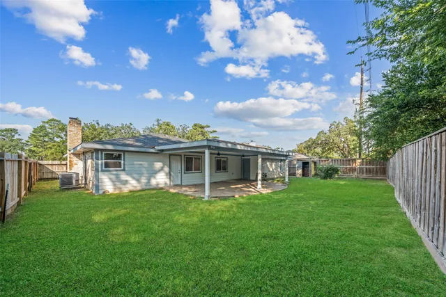 a view of a house with a yard porch and sitting area