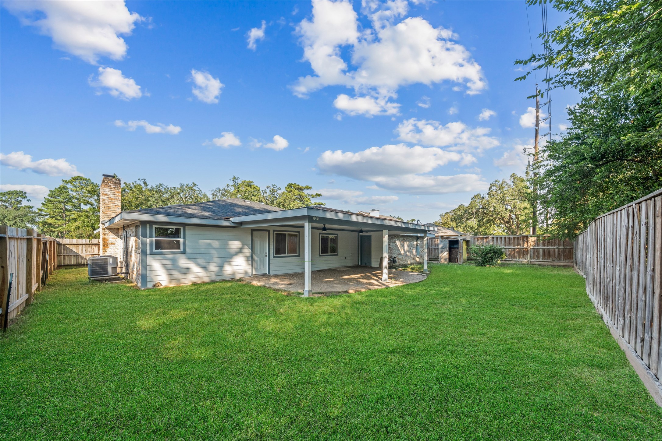 19218 Enchanted Oaks Drive Spring, TX 77388 - Photo 19 of 20 a view of a house with a yard porch and sitting area