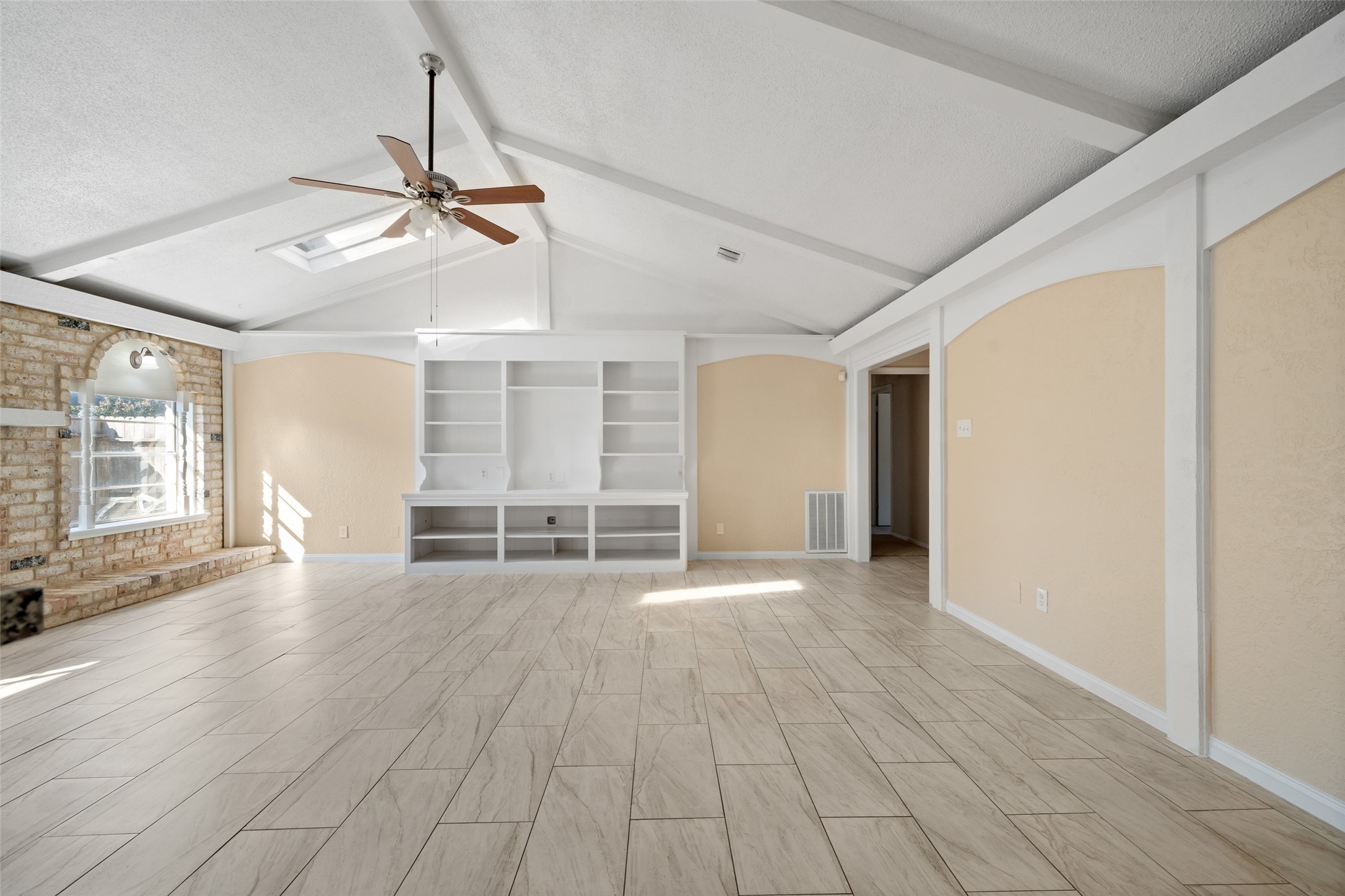 19218 Enchanted Oaks Drive Spring, TX 77388 - Photo 3 of 20 a view of empty room with wooden floor and fan