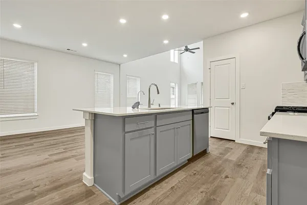 a bathroom with double vanity sink and a mirror