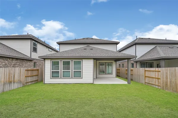 front view of a house with a garden