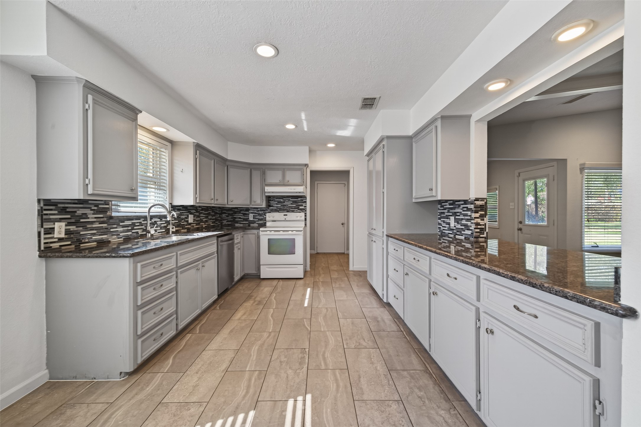 11811 Beverly Drive Houston, TX 77065 - Photo 13 of 48 a large kitchen with cabinets