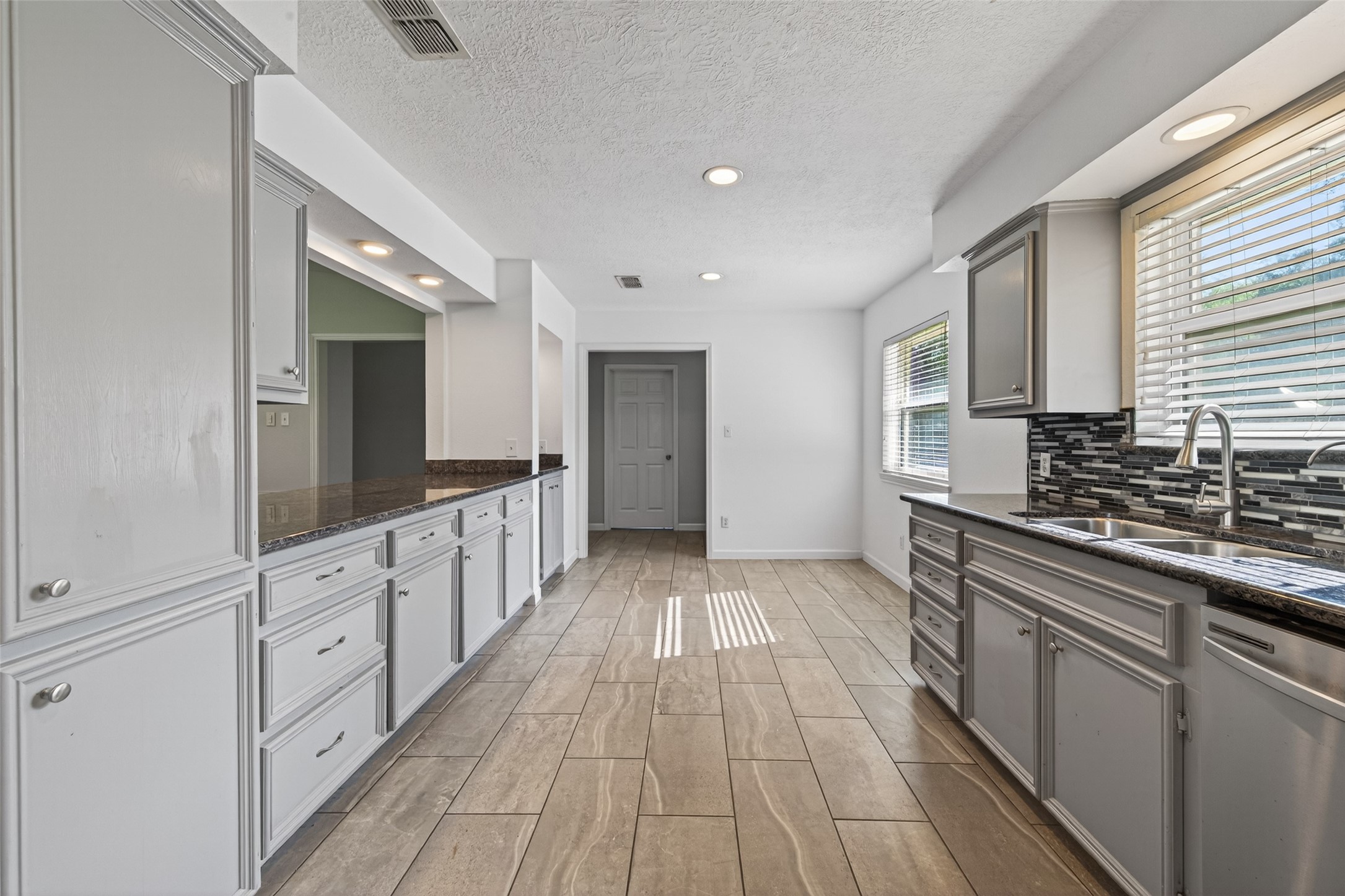 11811 Beverly Drive Houston, TX 77065 - Photo 18 of 48 a large kitchen with cabinets