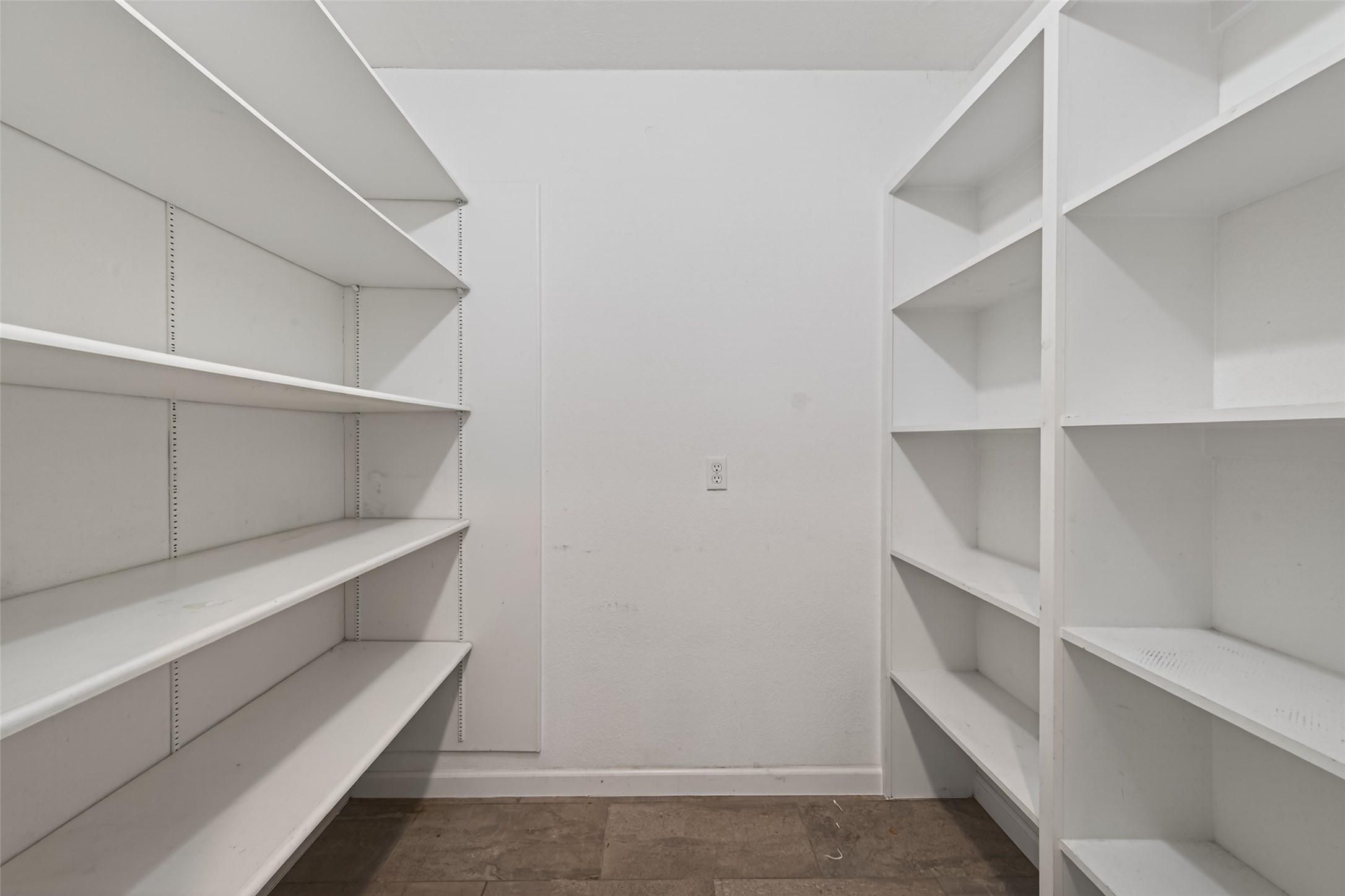 11811 Beverly Drive Houston, TX 77065 - Photo 19 of 48 a view of an empty walk in closet