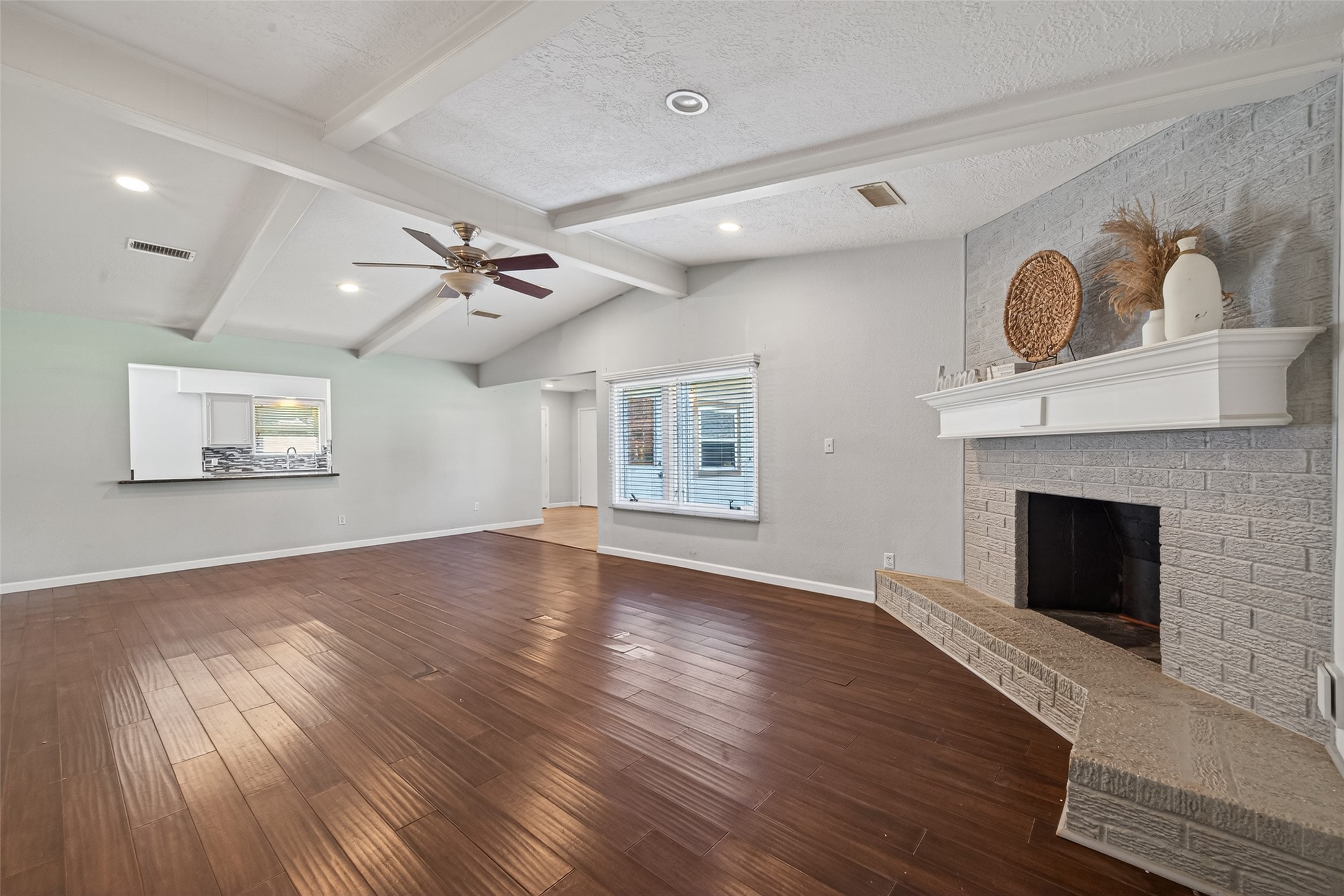 11811 Beverly Drive Houston, TX 77065 - Photo 26 of 48 a view of an empty room with a fireplace and a window